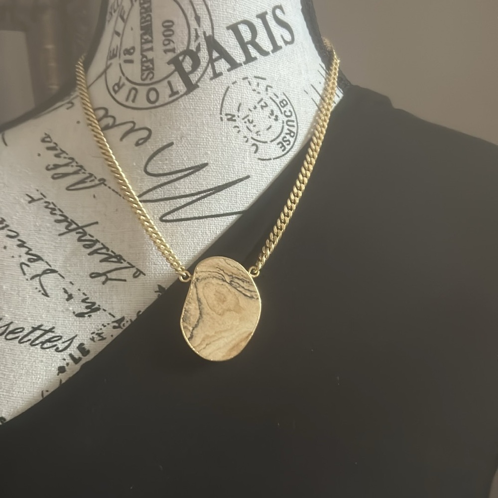 Bold statement stone with thick gold chain